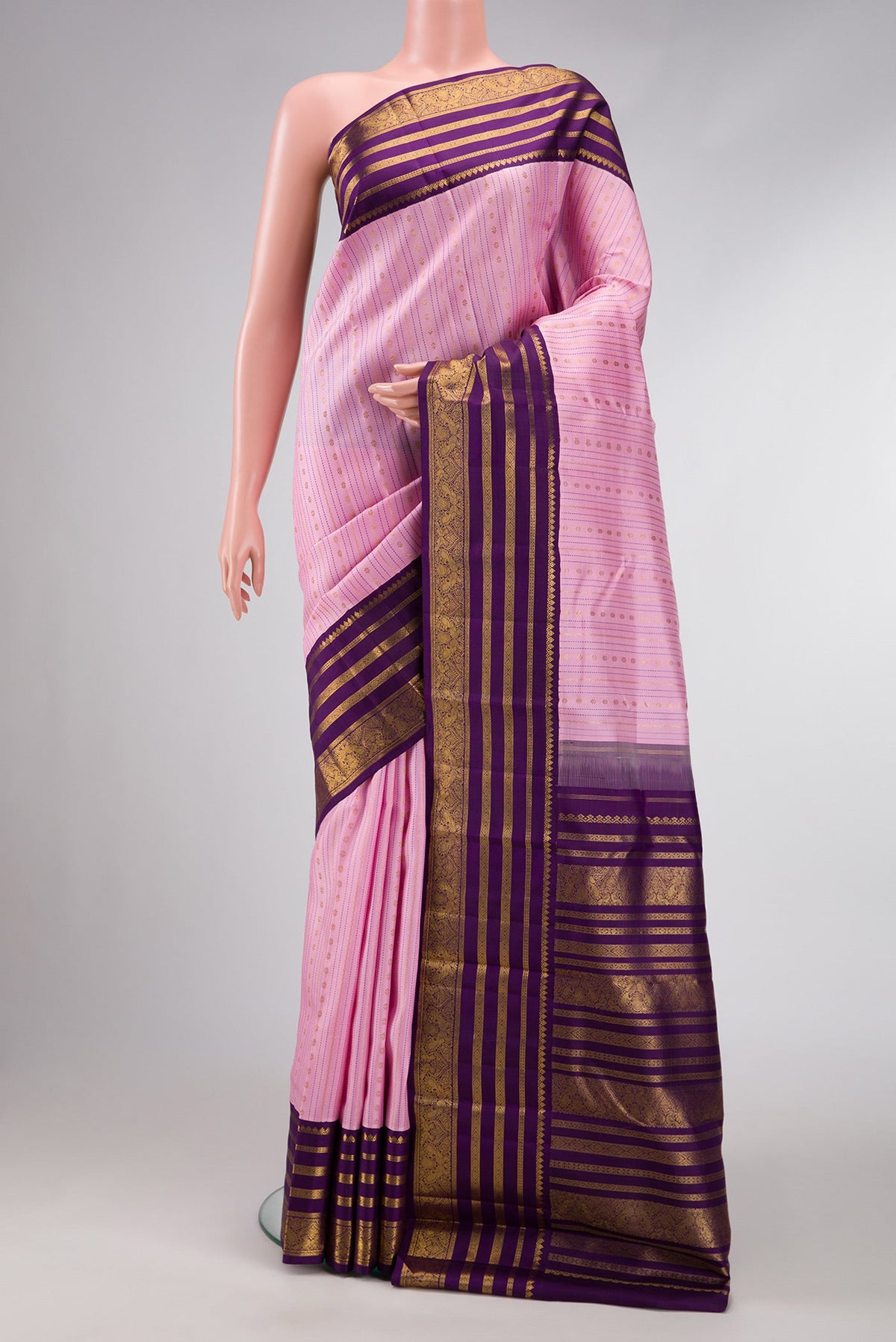 Pure Silk Pure Zari Pink Dual Tone Kanchipuram Saree with Stripes on the body and Zari Border.  displayed on a mannequin