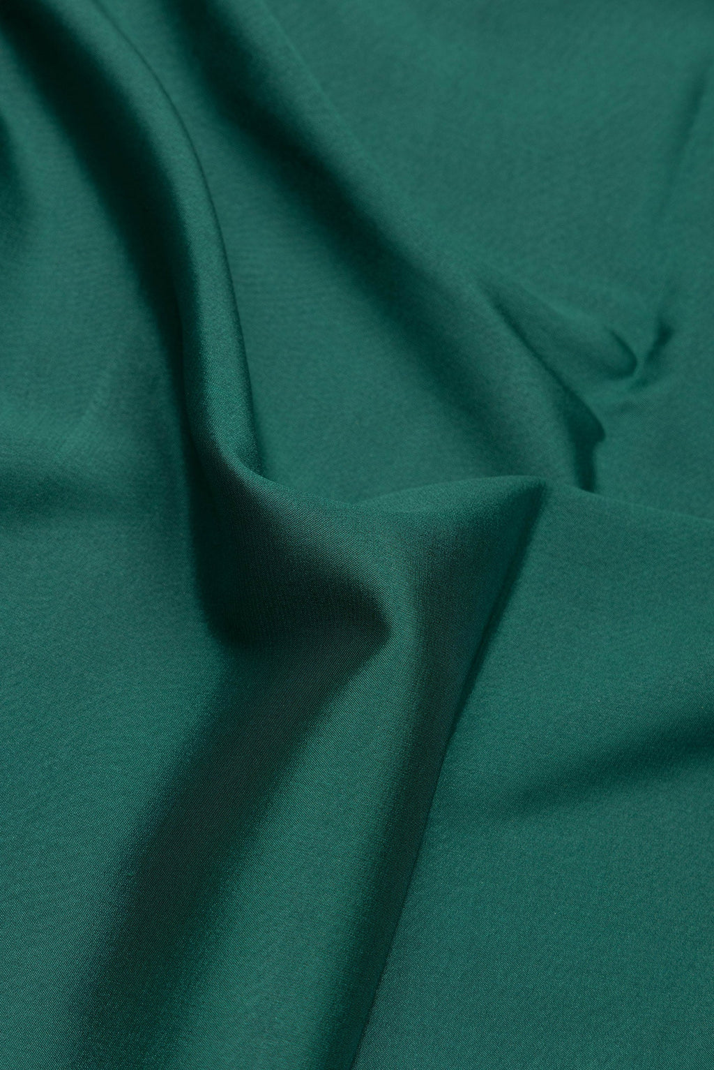 Close up of Bottle Green Dual Tone Mysore Silk Saree with Plain Body and Fancy Border.  displaying folds