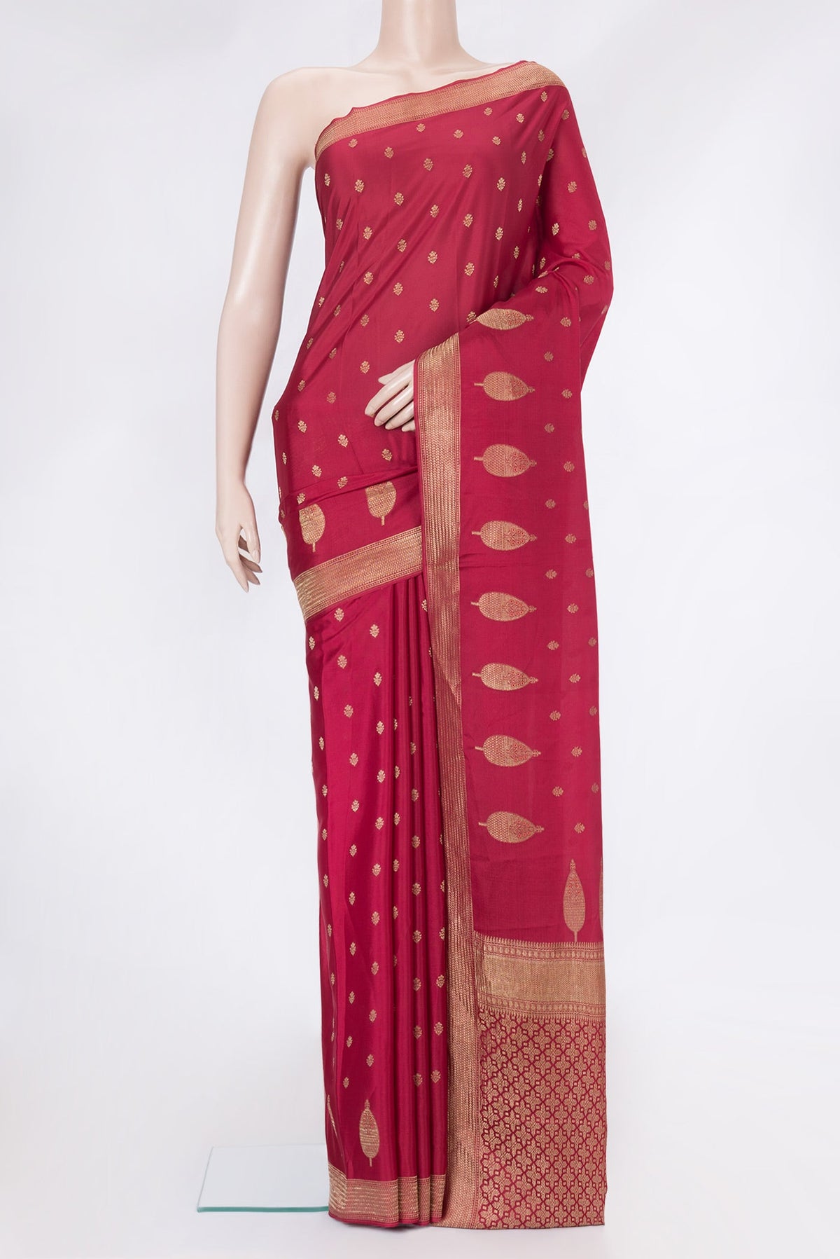 Red Mysore Crepe Saree with Zari And Thread Butta on the body and Zari Border.  displayed on a mannequin