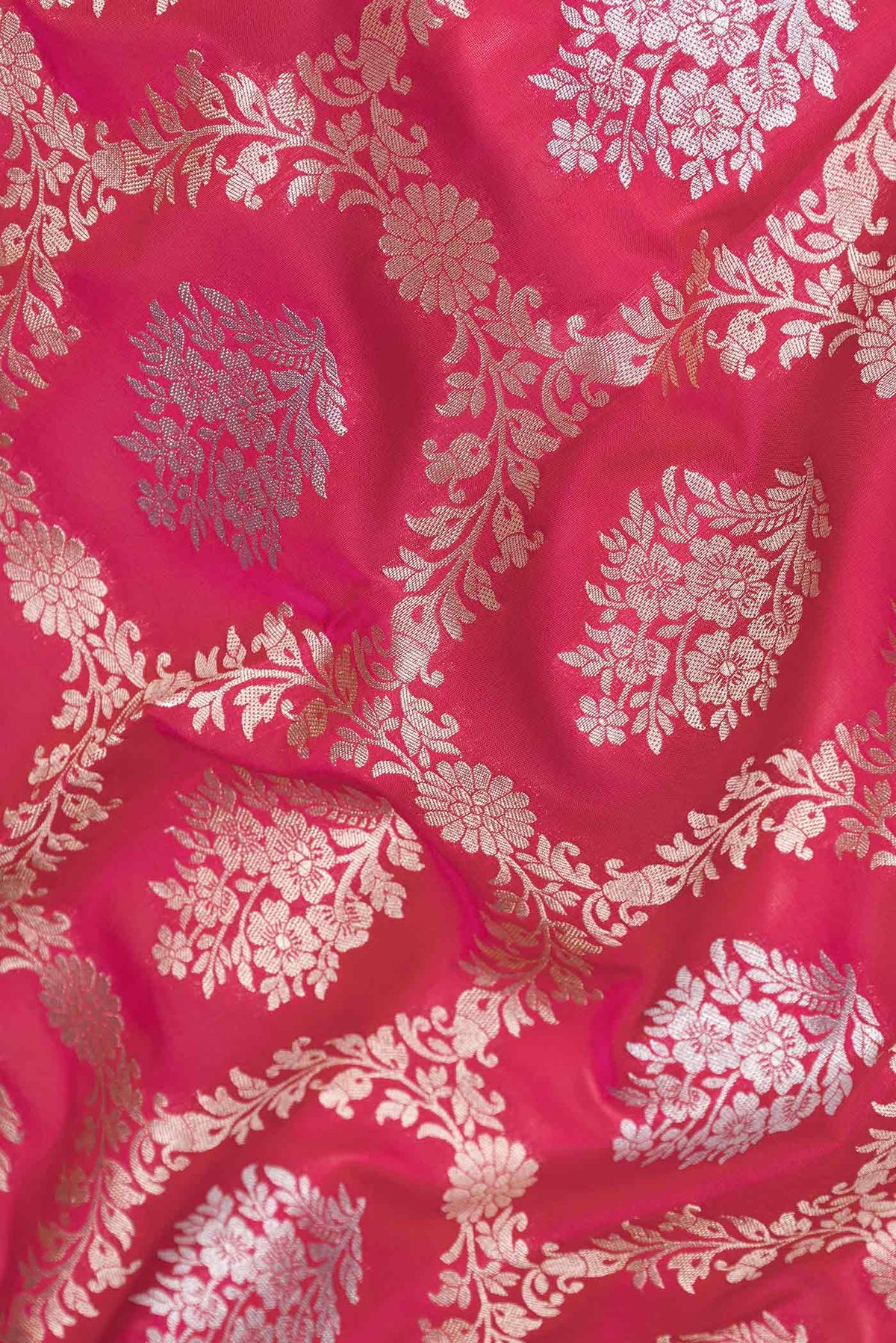 Close up of Dark Pink Dual Tone Blended Banarasi Saree with Zari Brocade on the body and Zari Border.  displaying folds