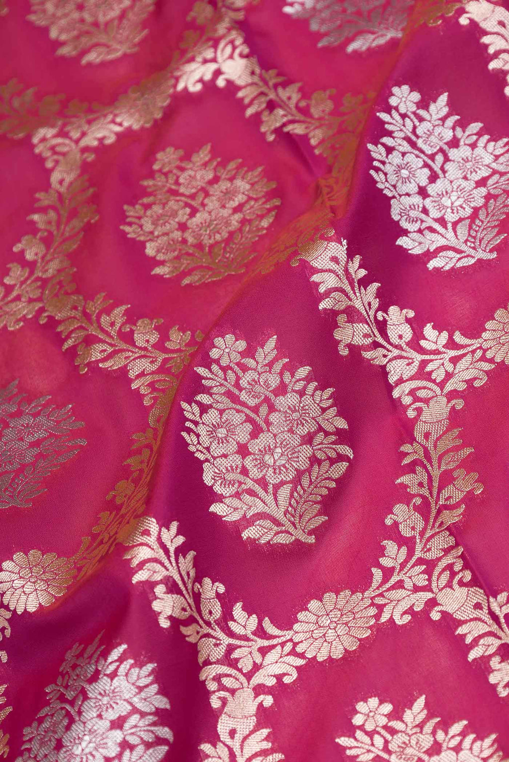 Close up of Dark Pink Dual Tone Blended Banarasi Saree with Zari Brocade on the body and Zari Border.  displaying folds