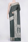 Bottle Green Dual Tone Blended Banarasi Saree with Zari Butta on the body and Zari Border.  displayed on a mannequin