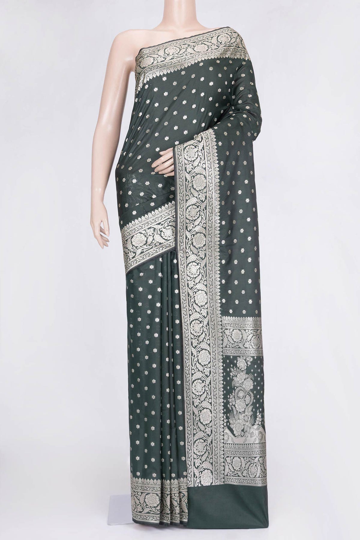 Bottle Green Dual Tone Blended Banarasi Saree with Zari Butta on the body and Zari Border.  displayed on a mannequin