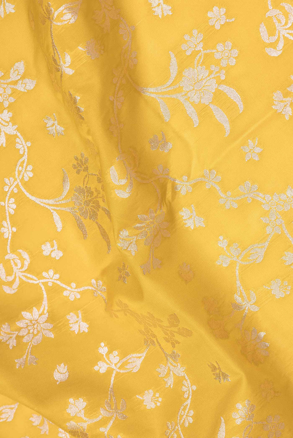 Close up of Yellow Dual Tone Blended Banarasi Saree with Zari Brocade on the body and Zari Border.  displaying folds