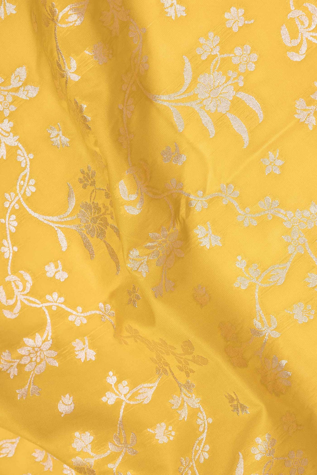 Close up of Yellow Dual Tone Blended Banarasi Saree with Zari Brocade on the body and Zari Border.  displaying folds