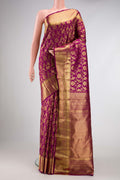Magenta Dual Tone Kanchipuram Silk Saree with Zari Brocade on the body and Zari Border.  displayed on a mannequin