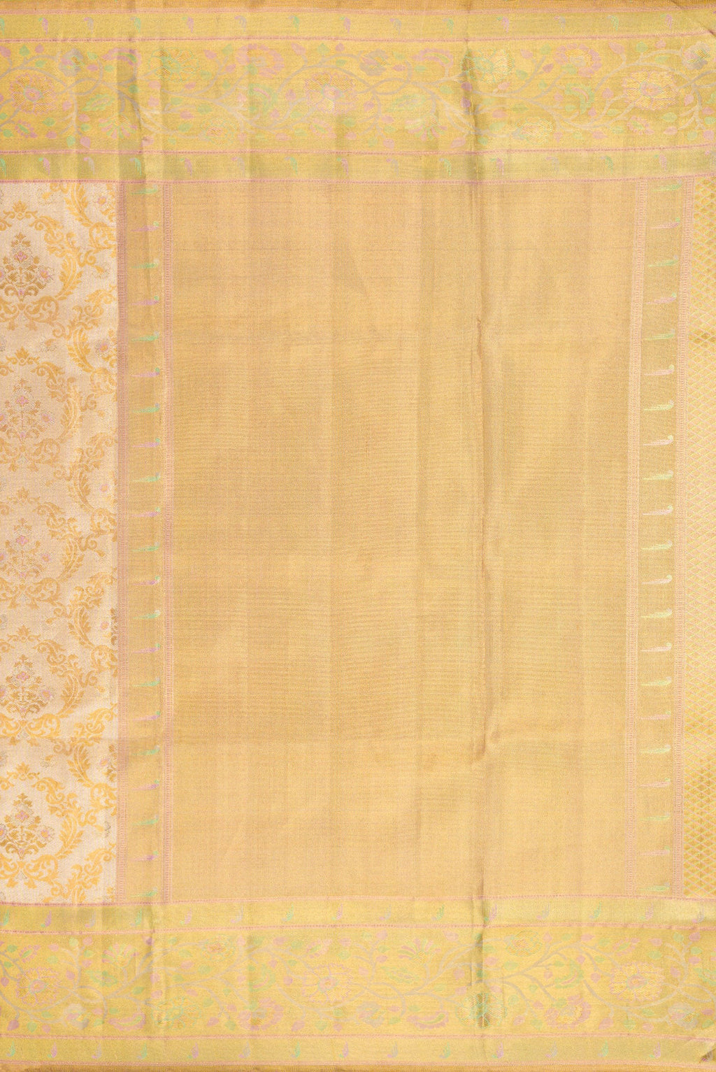 Close up image of the pallu of Gold Dual Tone Kanjivaram Tissue Silk Saree with Zari Brocade on the body and Fancy Border. 