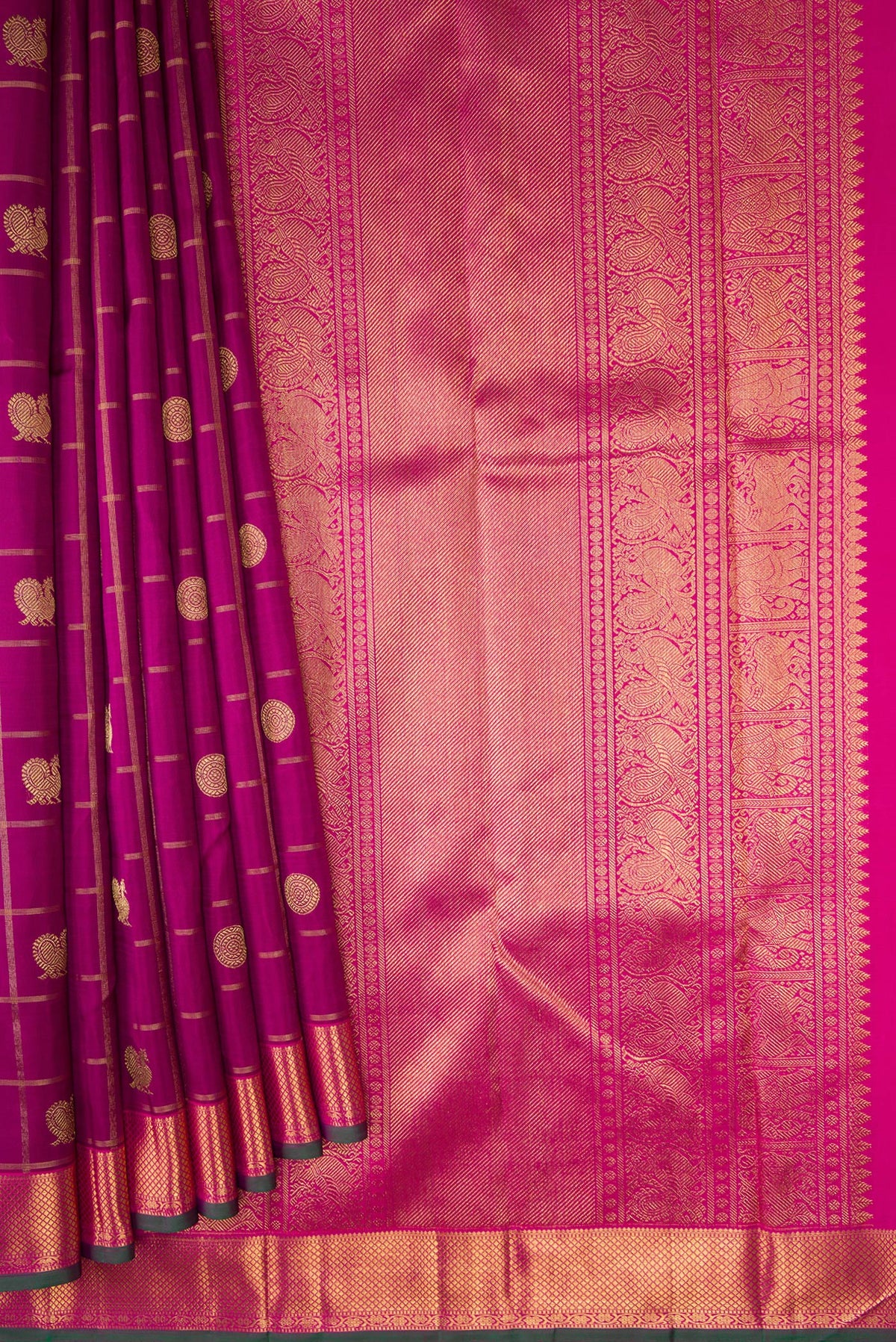 Pleats and pallu of Pure Silk Pure Zari Magenta Dual Tone Kanjivaram Saree with Checked design on the body and Zari Border. 