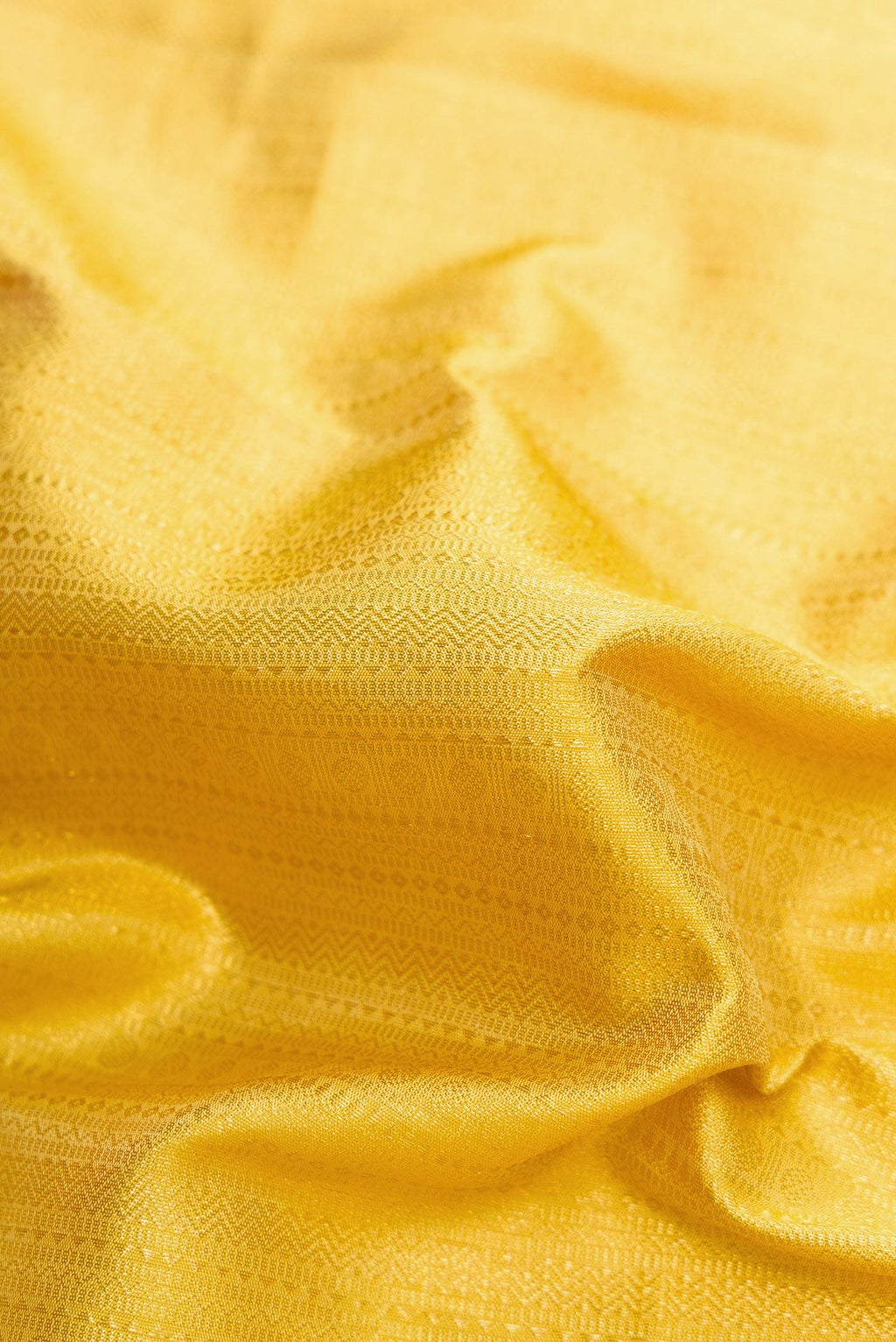 Close up of Sandal Dual Tone Kanchipuram Silk Saree with Zari Brocade on the body and Zari Border.  displaying folds
