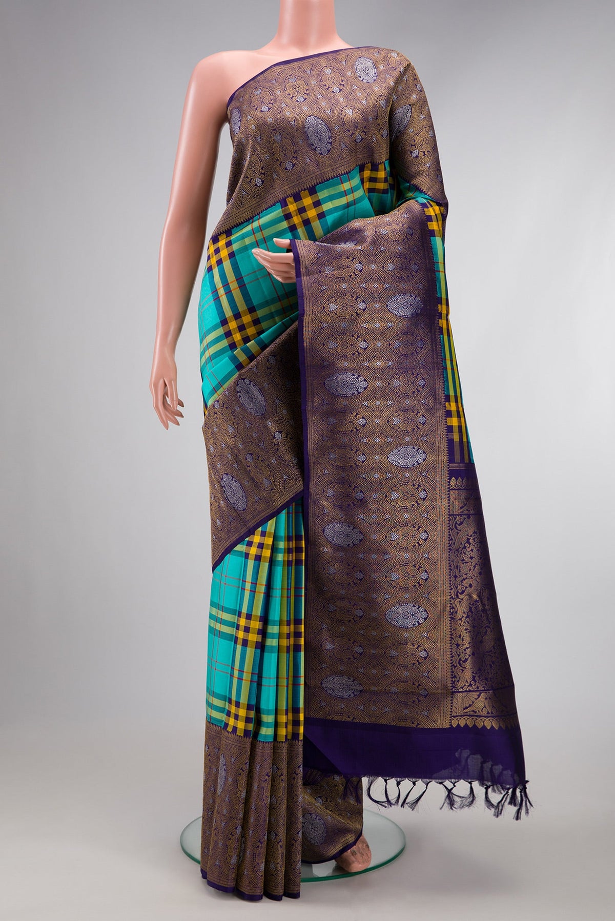 Pure Silk Pure Zari Multi Color Kanjivaram Saree with Checked design on the body and Fancy Border.  displayed on a mannequin