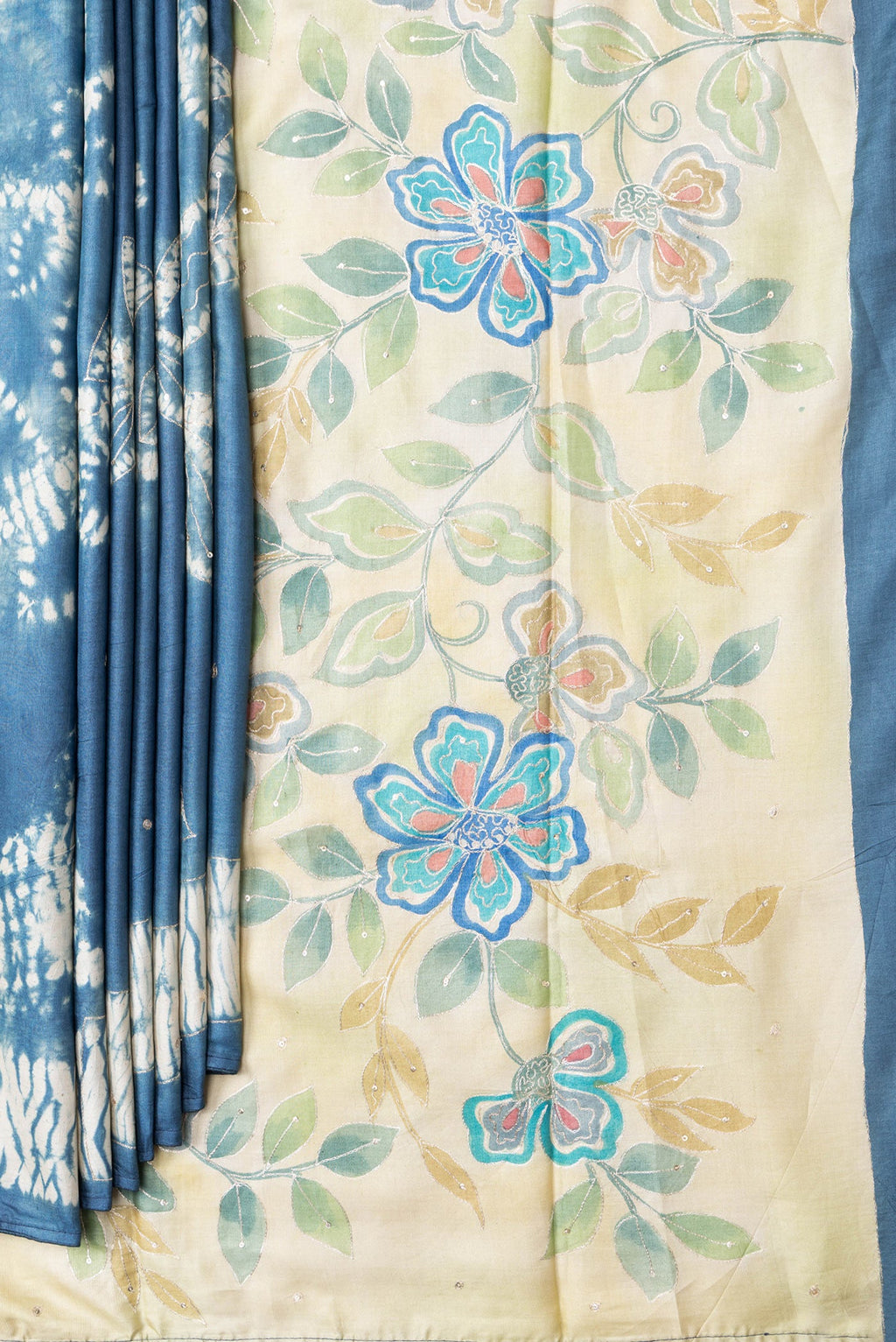 Pleats and pallu of Grey Dual Tone Tussar Silk Saree with Embroidery on the body and Fancy Border. 