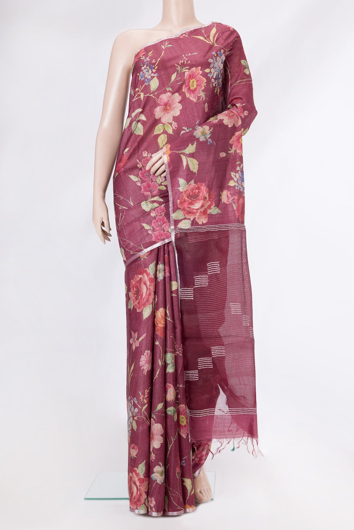 Maroon Dual Tone Tussar Silk Saree with Printed design on the body and Zari Border.  displayed on a mannequin