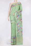 Green Dual Tone Tussar Silk Saree with Printed design on the body and Zari Border.  displayed on a mannequin