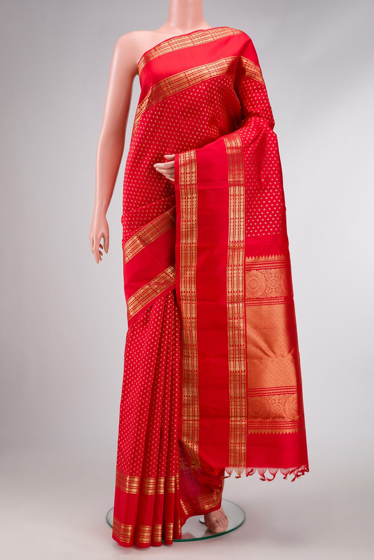 Pure Silk Pure Zari Red Dual Tone Kanjivaram Saree with Zari Butta on the body and Zari Border.  displayed on a mannequin