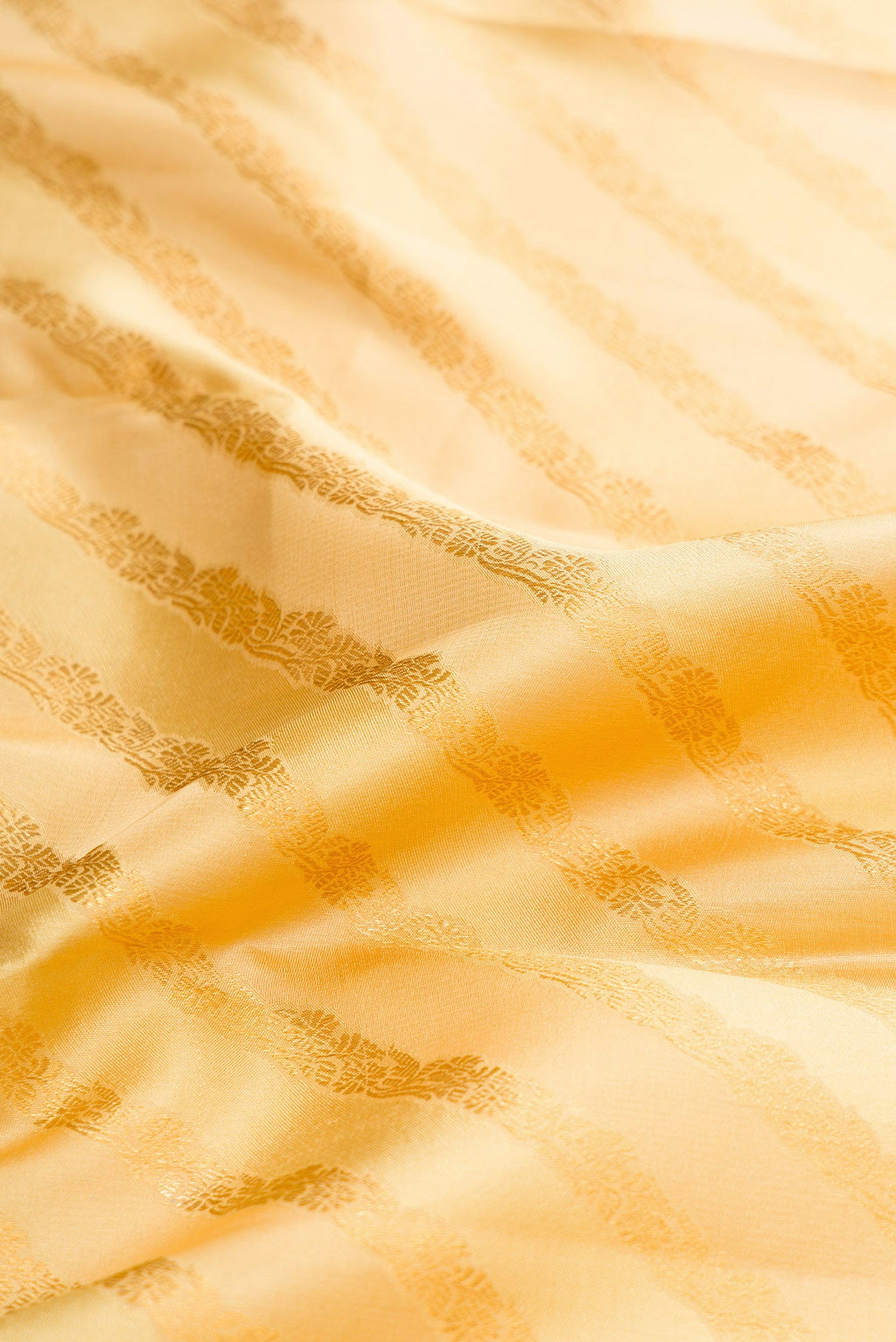 Close up of Sandal Dual Tone Kanjivaram Silk Saree with Zari Brocade on the body and Zari Border.  displaying folds