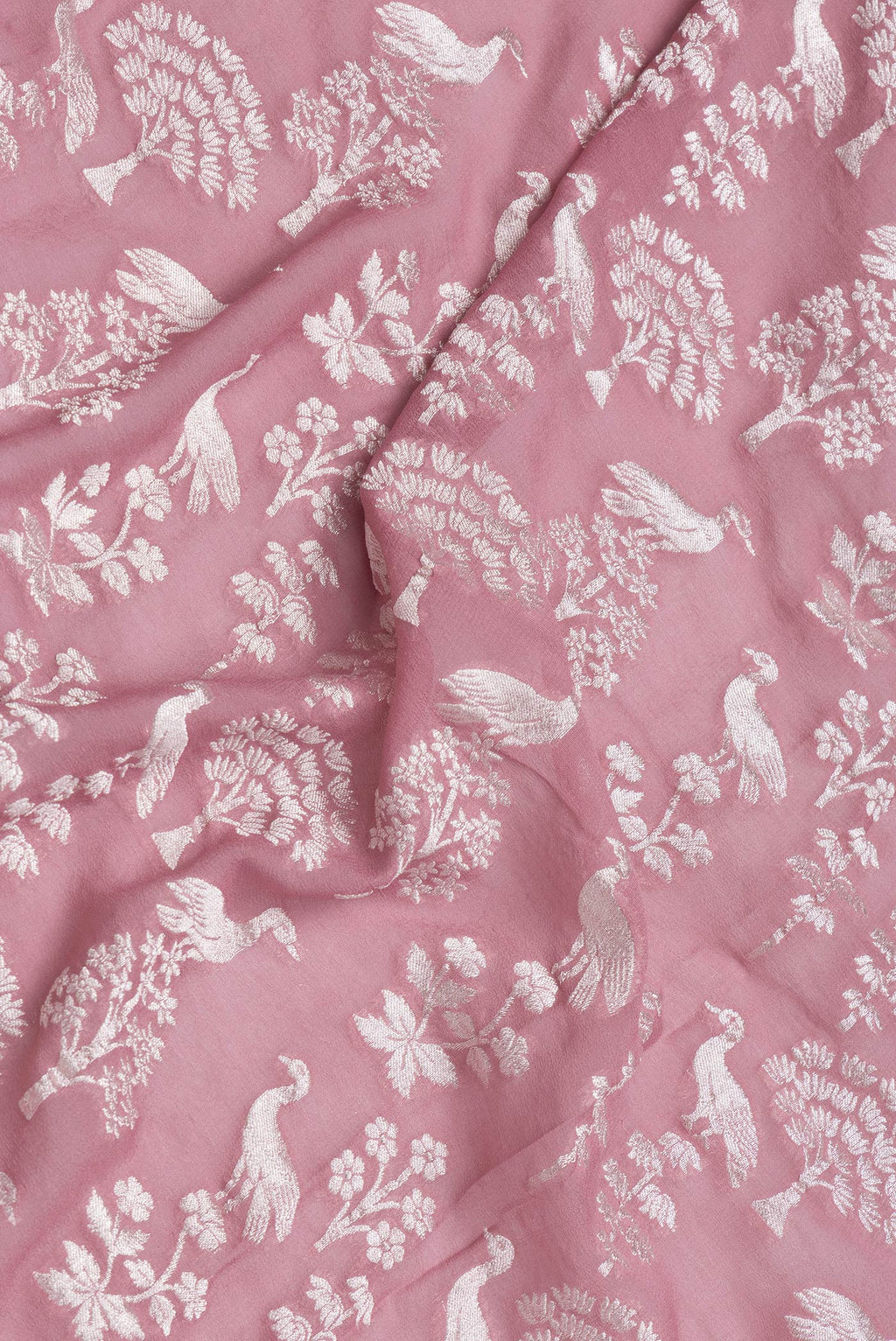Close up of Pink Dual Tone Banarasi Georgette Saree with Zari Brocade on the body and Zari Border.  displaying folds
