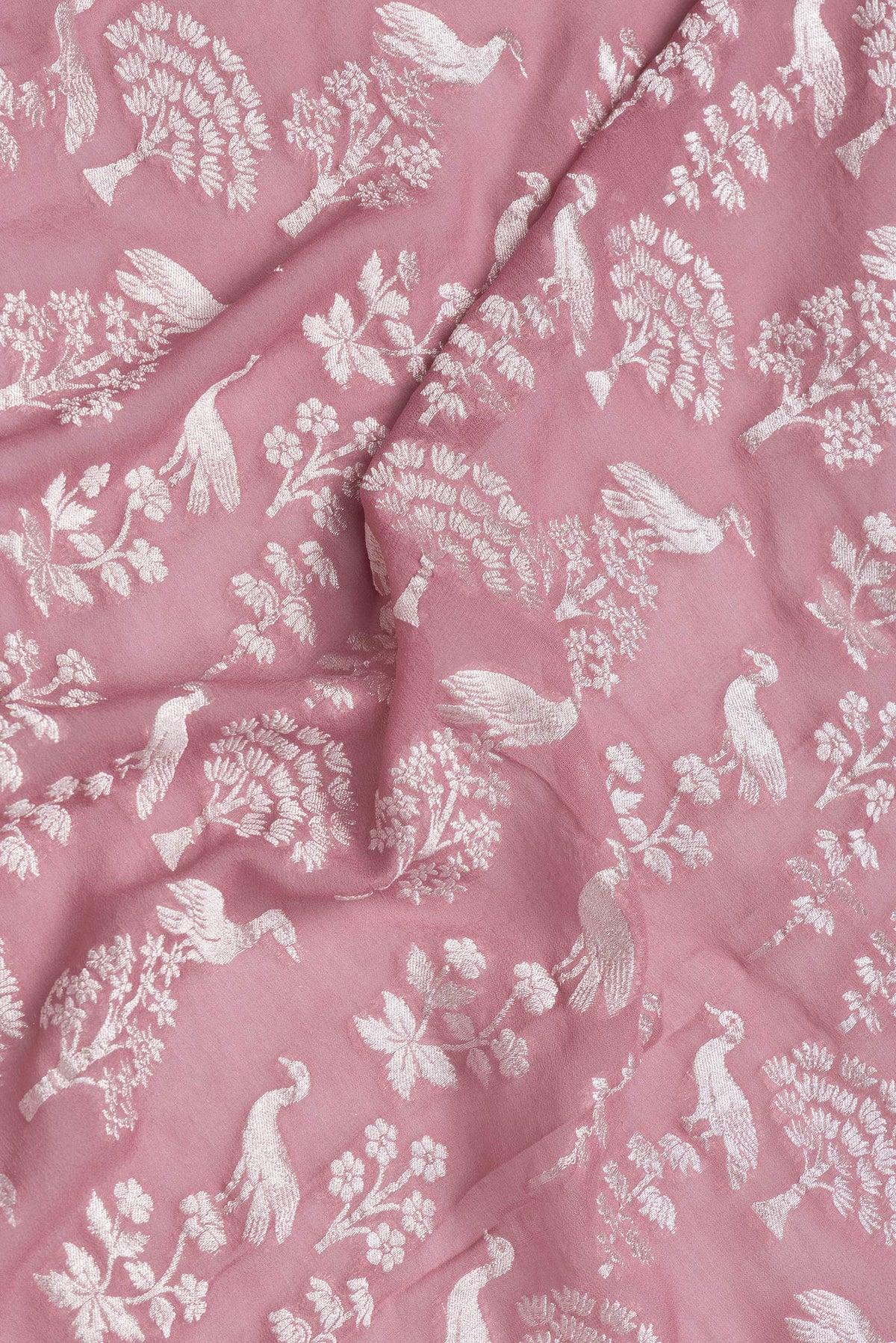 Close up of Pink Dual Tone Banarasi Georgette Saree with Zari Brocade on the body and Zari Border.  displaying folds