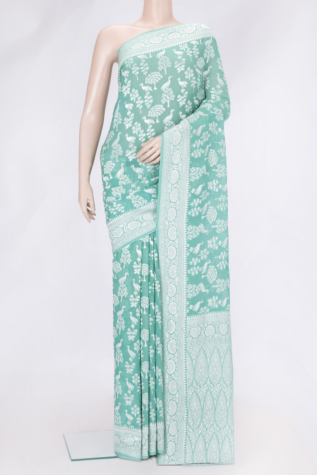 Sea Green Dual Tone Banarasi Georgette Saree with Zari Brocade on the body and Zari Border.  displayed on a mannequin