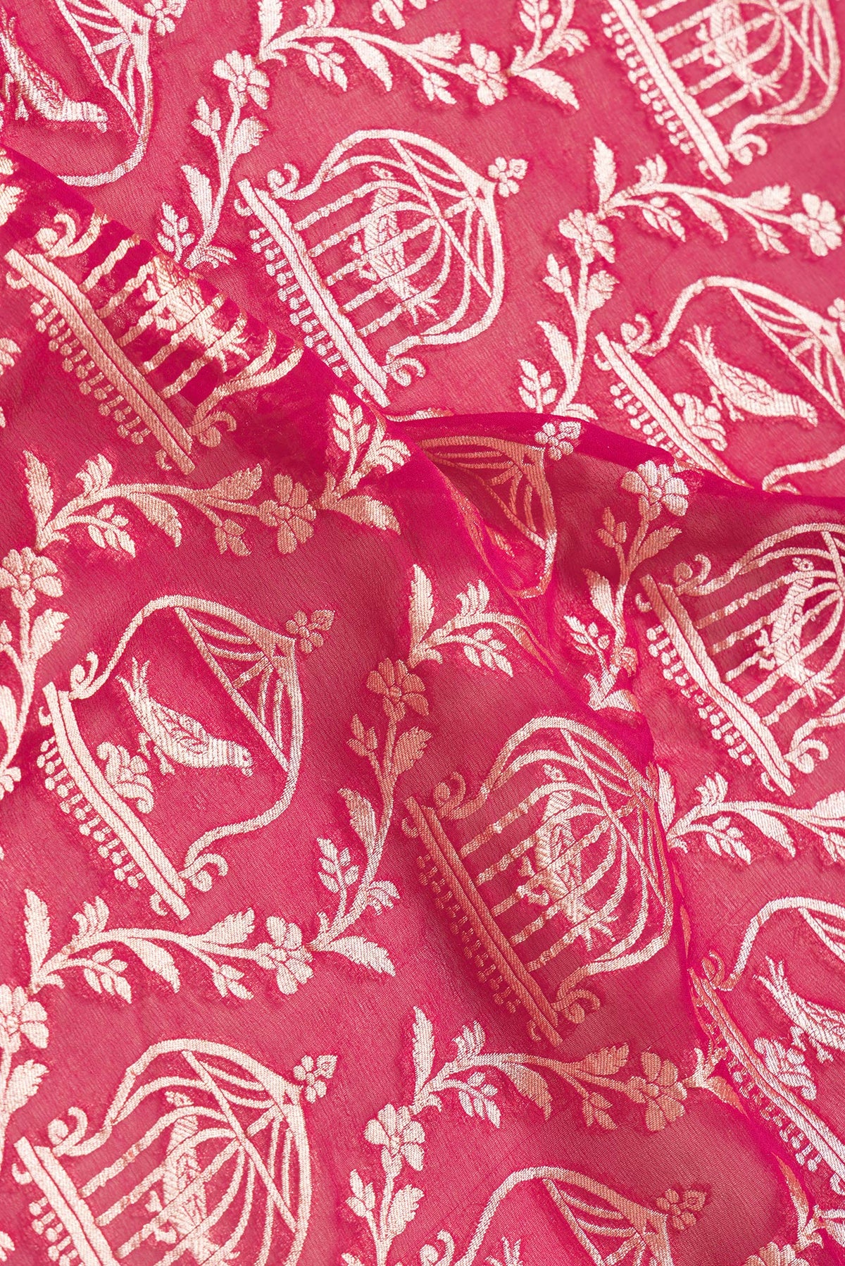 Close up of Pink Dual Tone Banarasi Georgette Saree with Zari Brocade on the body and Zari Border.  displaying folds