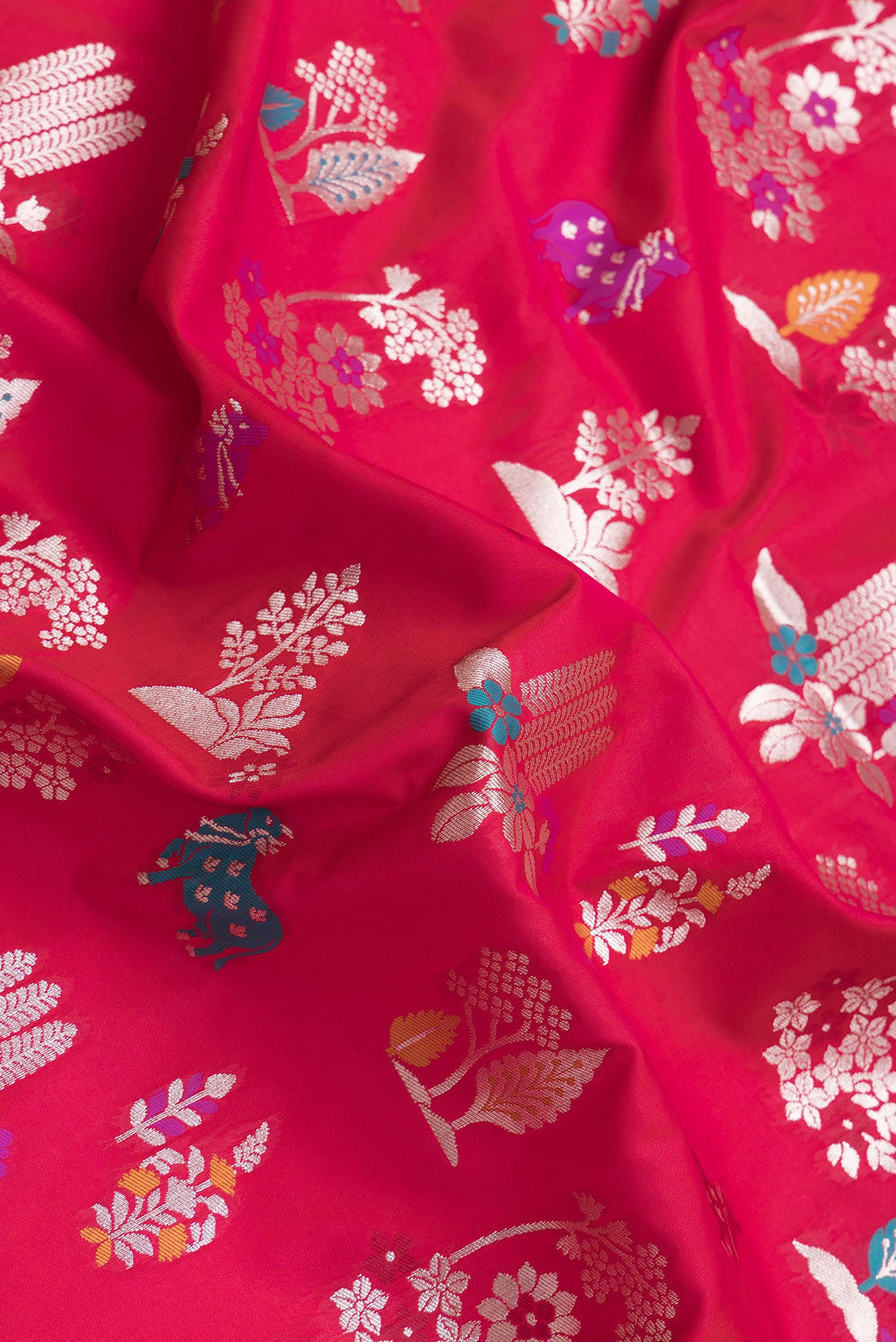 Close up of Dark Pink Dual Tone Blended Banarasi Silk Saree with Zari And Thread Butta on the body and Zari Border.  displaying folds