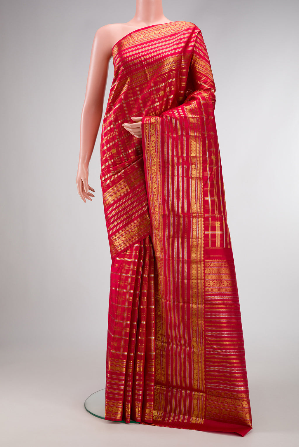 Red Kanjivaram Silk Saree with Checked design on the body and Zari Border.  displayed on a mannequin