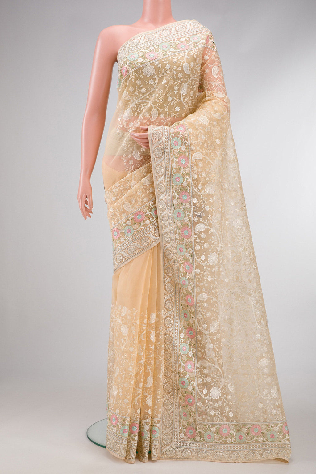 Sandal Dual Tone Organza Silk Saree with Embroidery on the body and Embroidery Border.  displayed on a mannequin