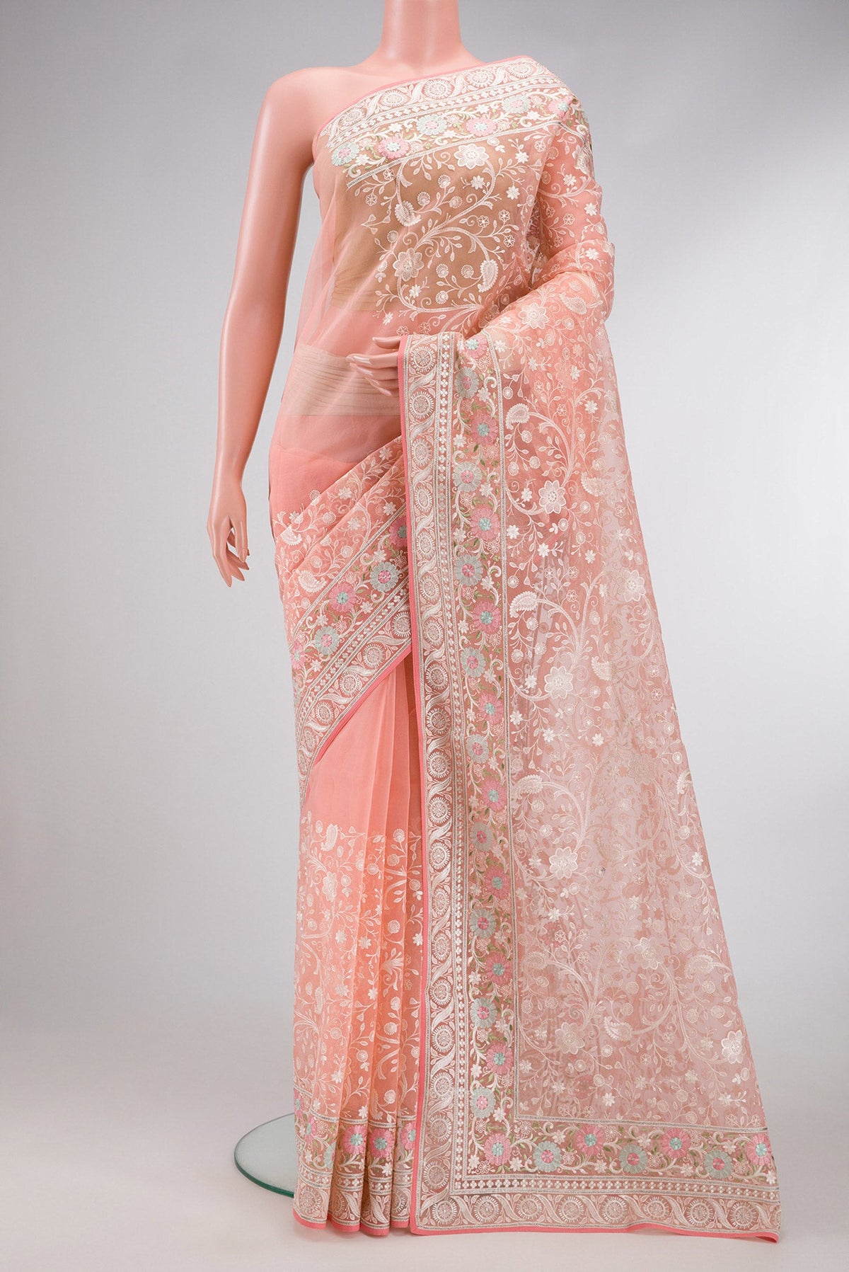 Golden Peach Dual Tone Organza Silk Saree with Embroidery on the body and Embroidery Border.  displayed on a mannequin