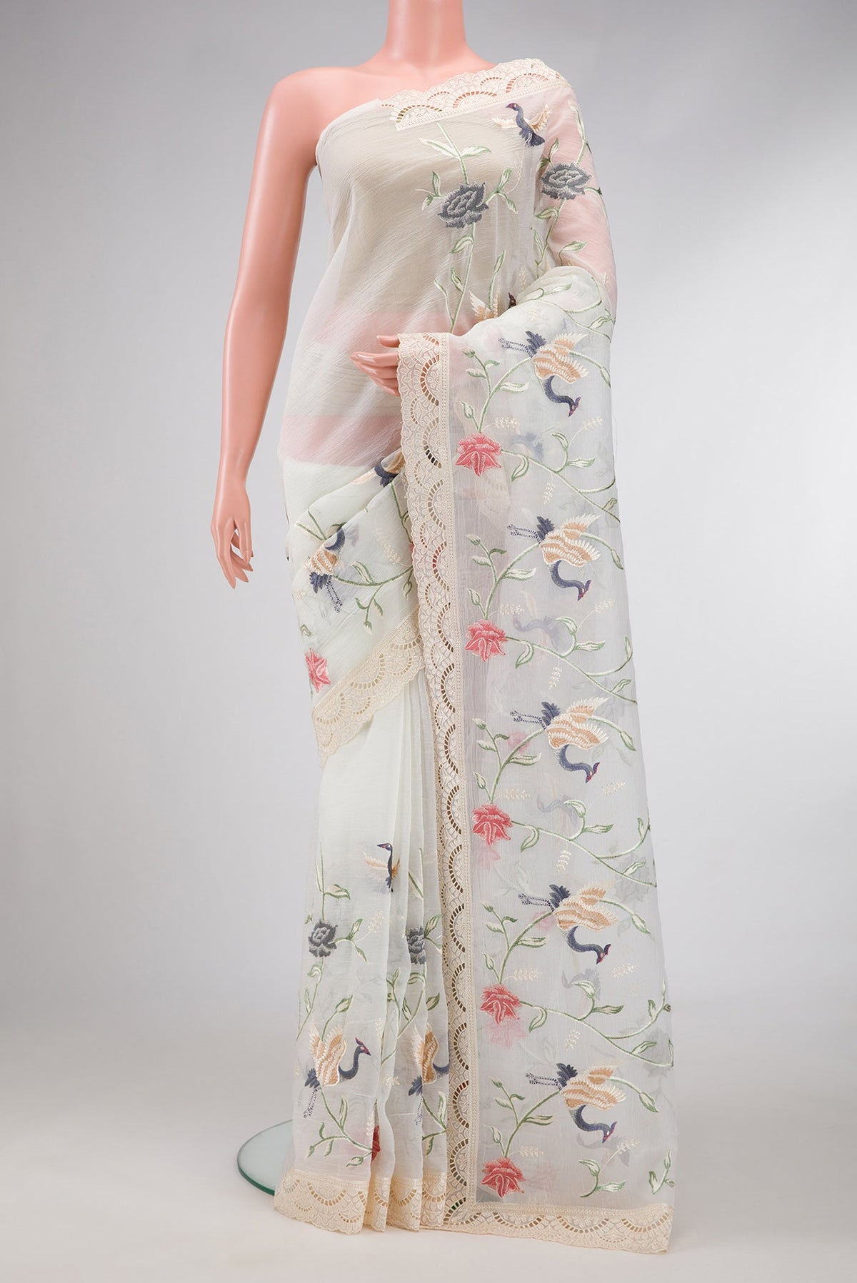 Off White Dual Tone Organza Silk Saree with Embroidery on the body and Embroidery Border.  displayed on a mannequin
