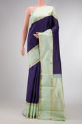 Navy Blue Dual Tone Kanjivaram Silk Saree with Checked design on the body and Zari Border.  displayed on a mannequin