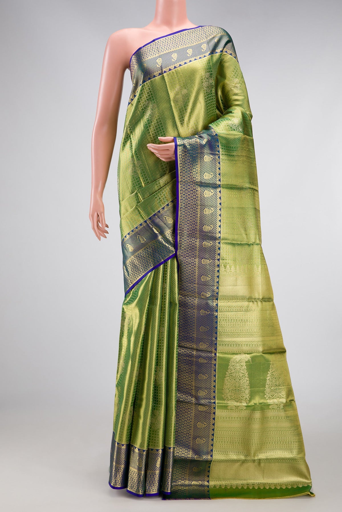 Parrot Green Dual Tone Kanchipuram Tissue Silk Saree with Zari Brocade on the body and Zari Border.  displayed on a mannequin