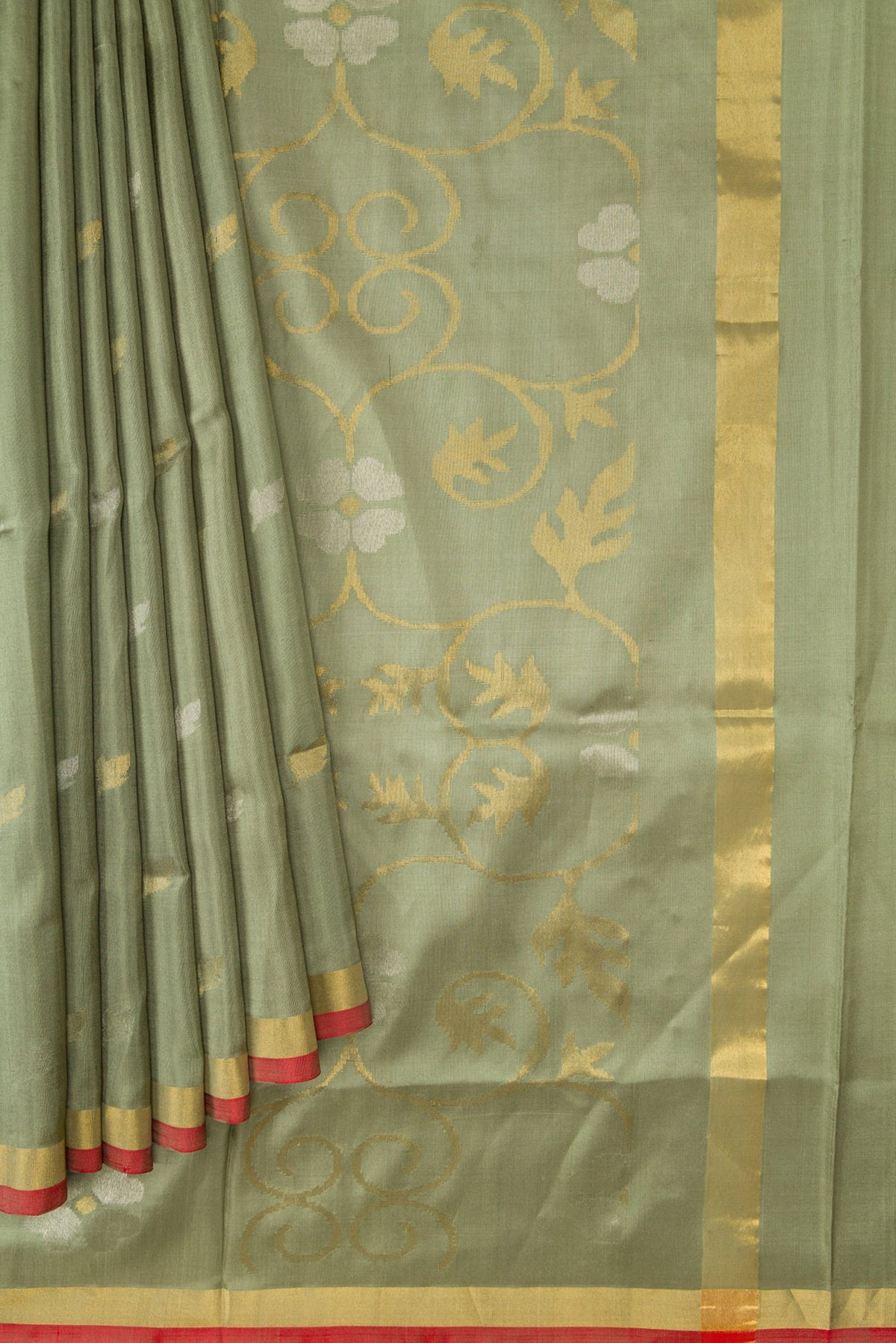 Pleats and pallu of Light Green Dual Tone Soft Silk Saree with Zari Butta on the body and Zari Border. 