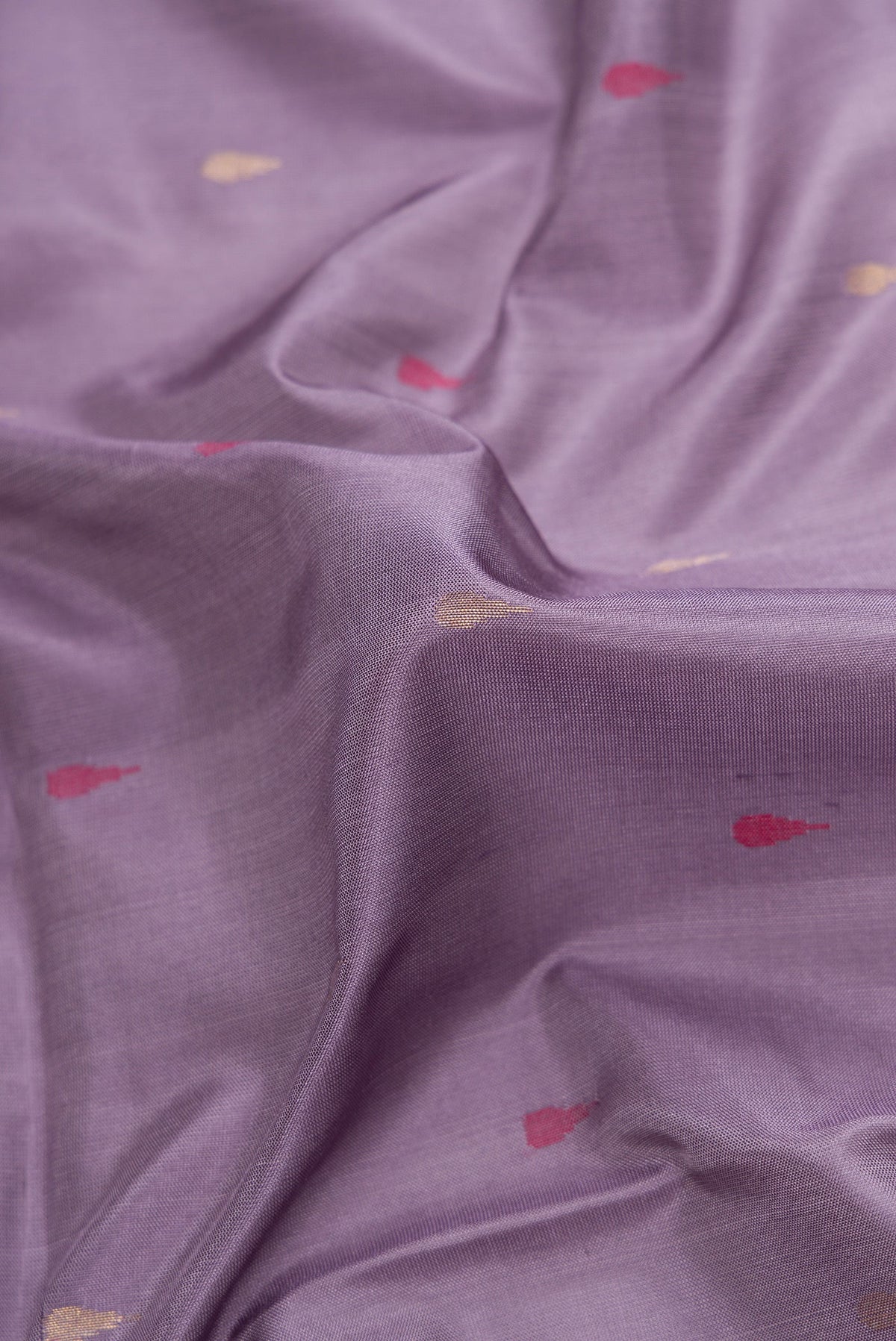 Close up of Purple Dual Tone Uppada Silk Saree with Zari And Thread Butta on the body and Zari Border.  displaying folds