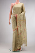 Beige Dual Tone Uppada Silk Saree with Zari And Thread Butta on the body and Temple Border.  displayed on a mannequin