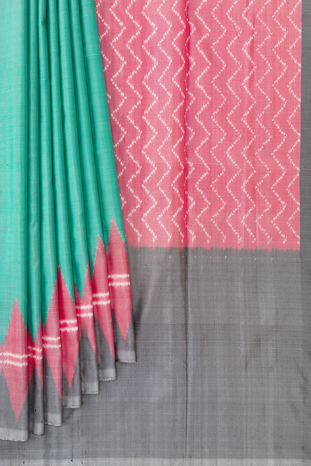 Pleats and pallu of Green Dual Tone Double Ikat Saree with Plain Body and Temple Border. 