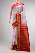 Off White Dual Tone Gadwal Silk Saree with Checked design on the body and Zari Border.  displayed on a mannequin