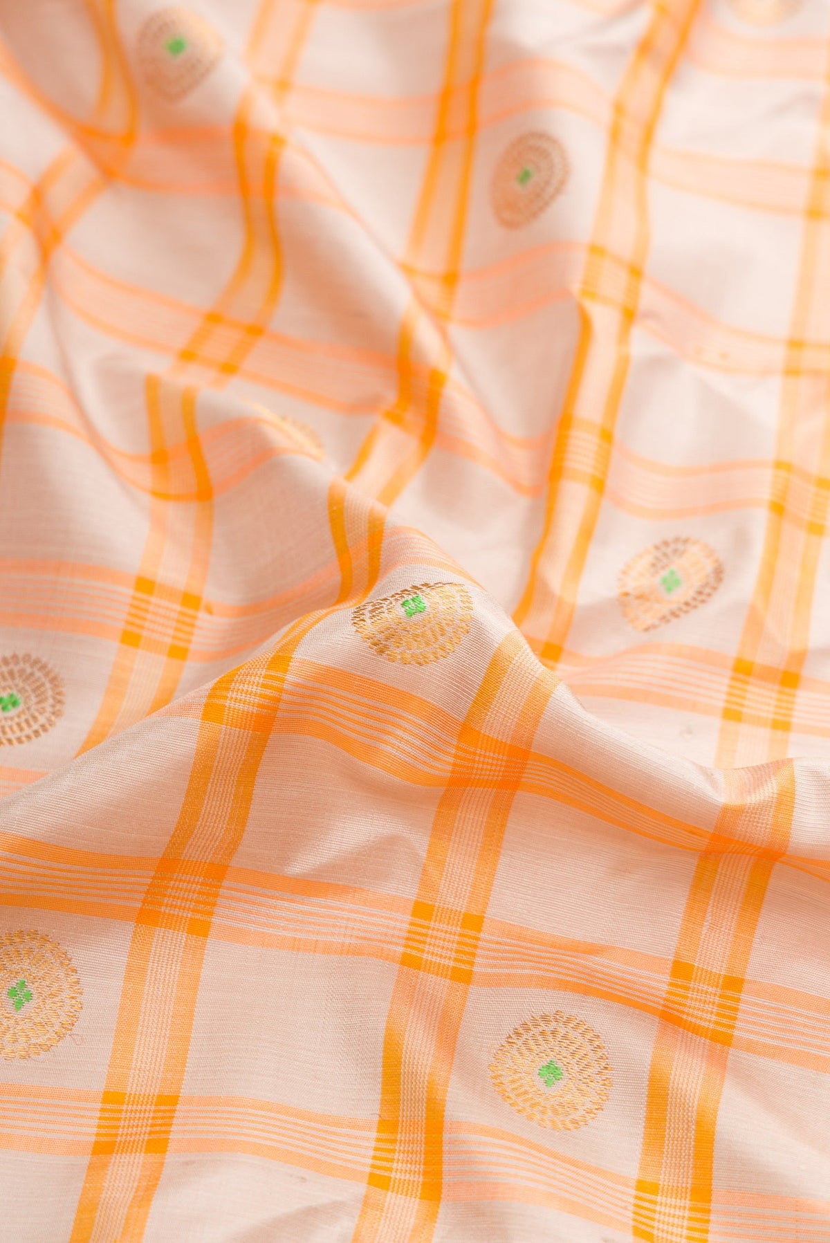 Close up of Grey Dual Tone Gadwal Silk Saree with Checked design on the body and Zari Border.  displaying folds