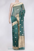 Peacock Blue Dual Tone Organza Silk Saree with Zari Butta on the body and Zari Border.  displayed on a mannequin
