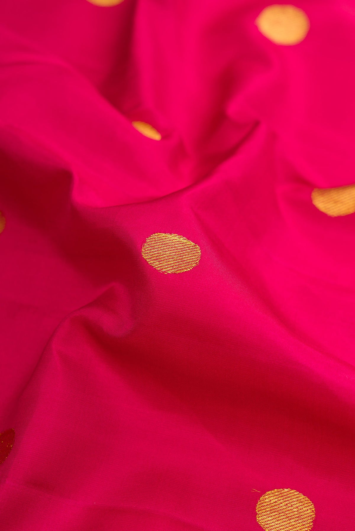 Close up of Pure Silk Pure Zari Maroon Dual Tone Kanjivaram Nine Yards Saree with Zari Butta on the body and Zari Border.  displaying folds