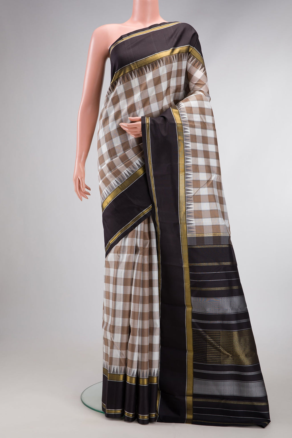 Pure Silk Pure Zari Beige and Off White Color Kanchipuram Saree with Checked design on the body and Zari Border.  displayed on a mannequin