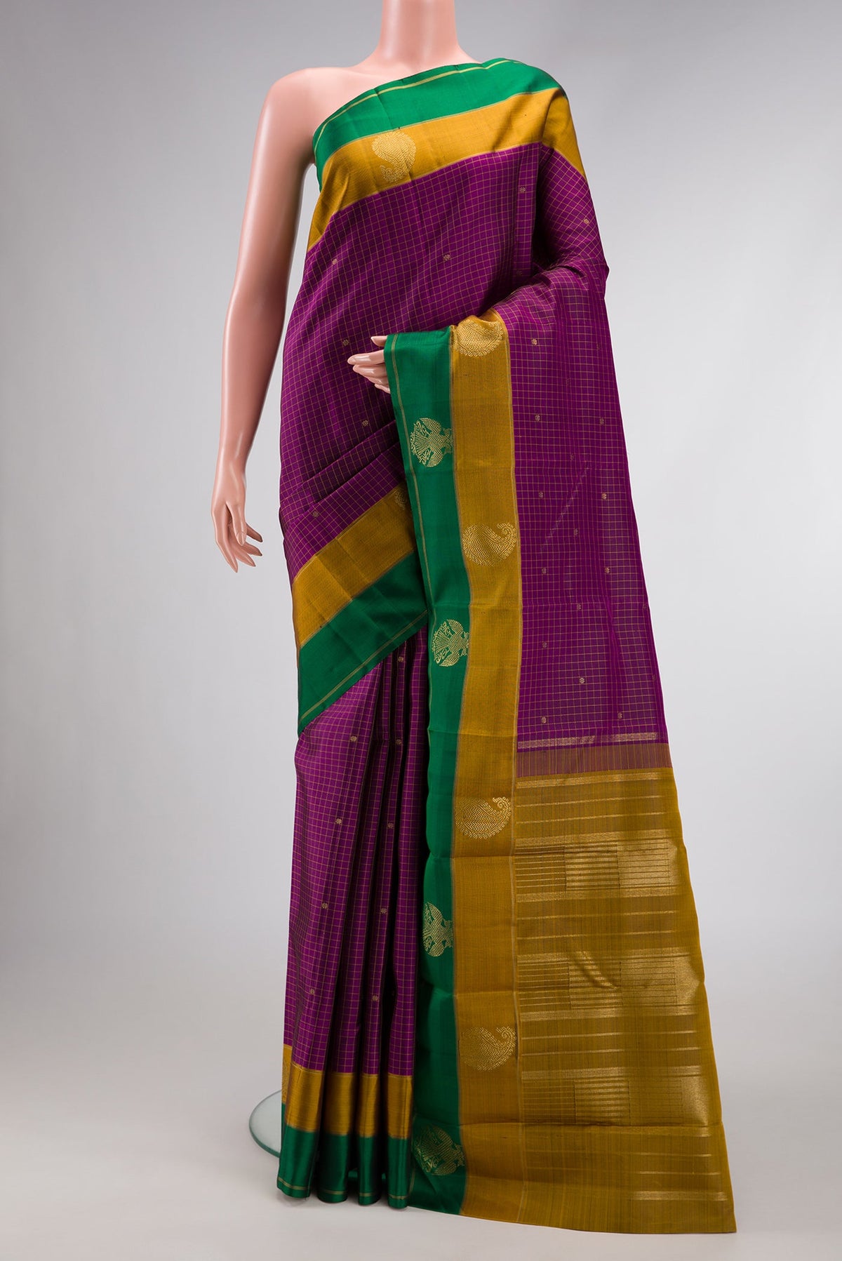 Pure Silk Pure Zari Burgundy Dual Tone Kanchipuram Saree with Checked design on the body and Fancy Border.  displayed on a mannequin