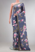 Grey Dual Tone Organza Silk Saree with Printed design on the body and Embroidery Border.  displayed on a mannequin