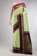 Pure Silk Pure Zari Parrot Green Dual Tone Kanjivaram Saree with Zari Butta on the body and Zari Border.  displayed on a mannequin
