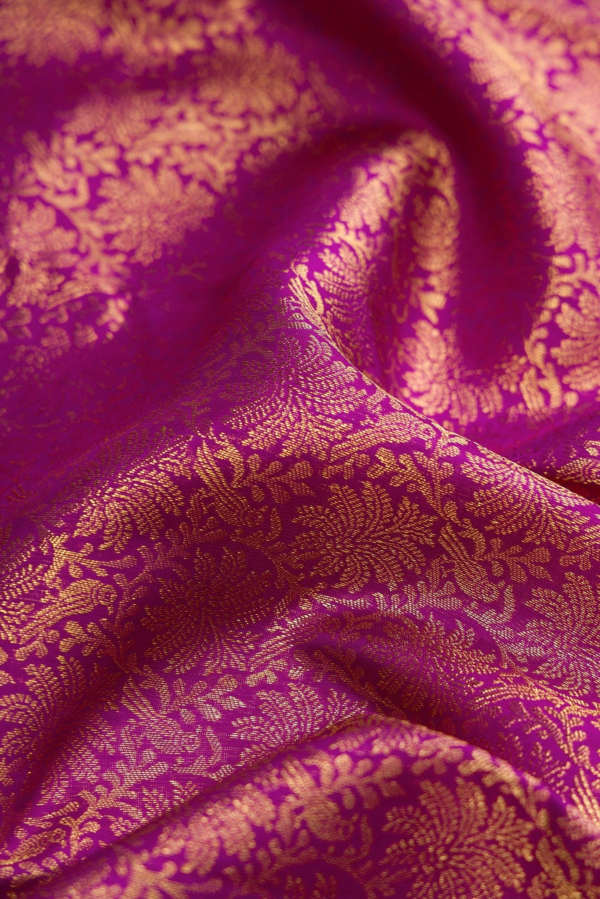 Close up of Purple Dual Tone Kanjivaram Silk Saree with Zari Brocade on the body and Zari Border.  displaying folds