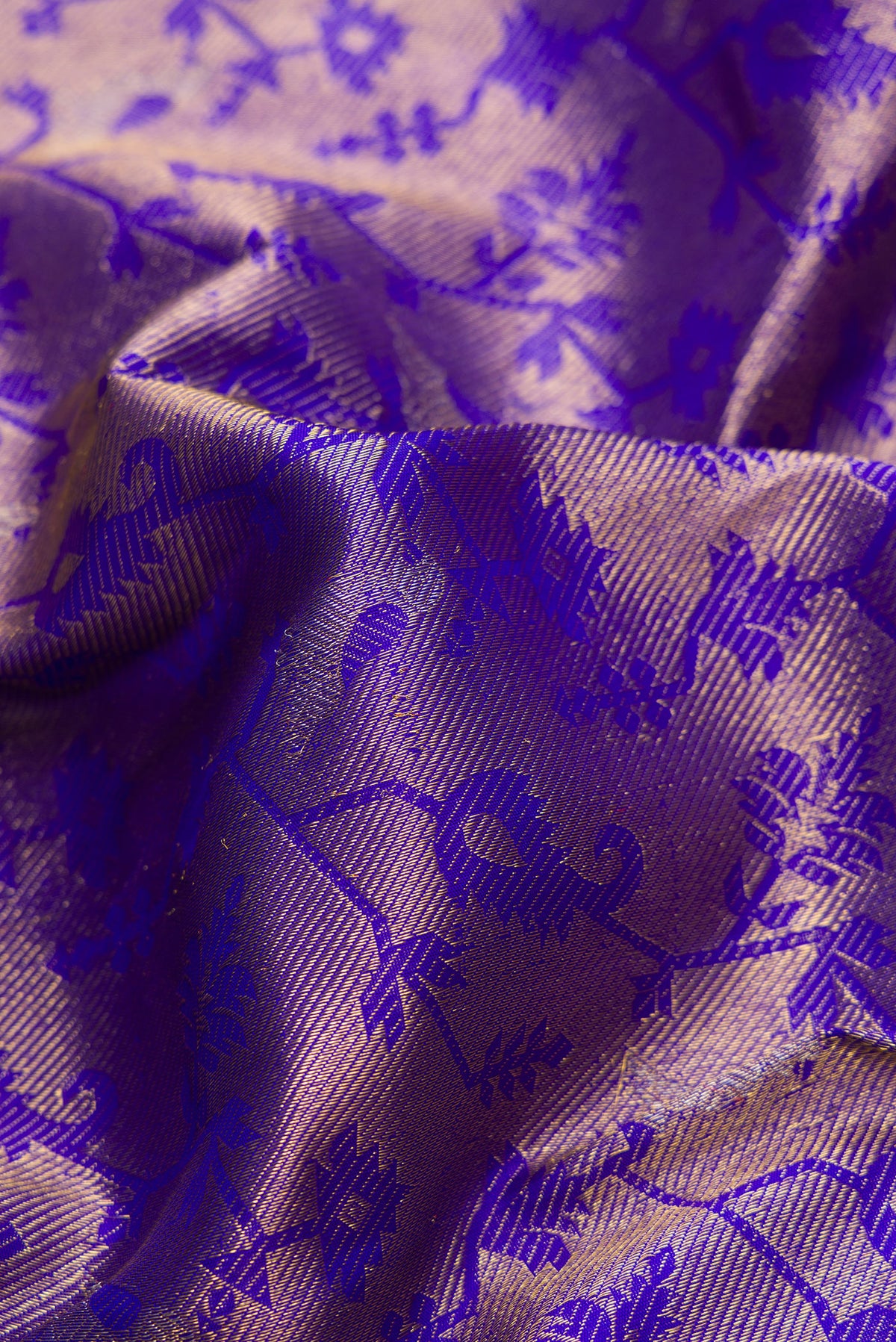 Close up of Royal Blue Kanchipuram Silk Saree with Zari Brocade on the body and Zari Border.  displaying folds