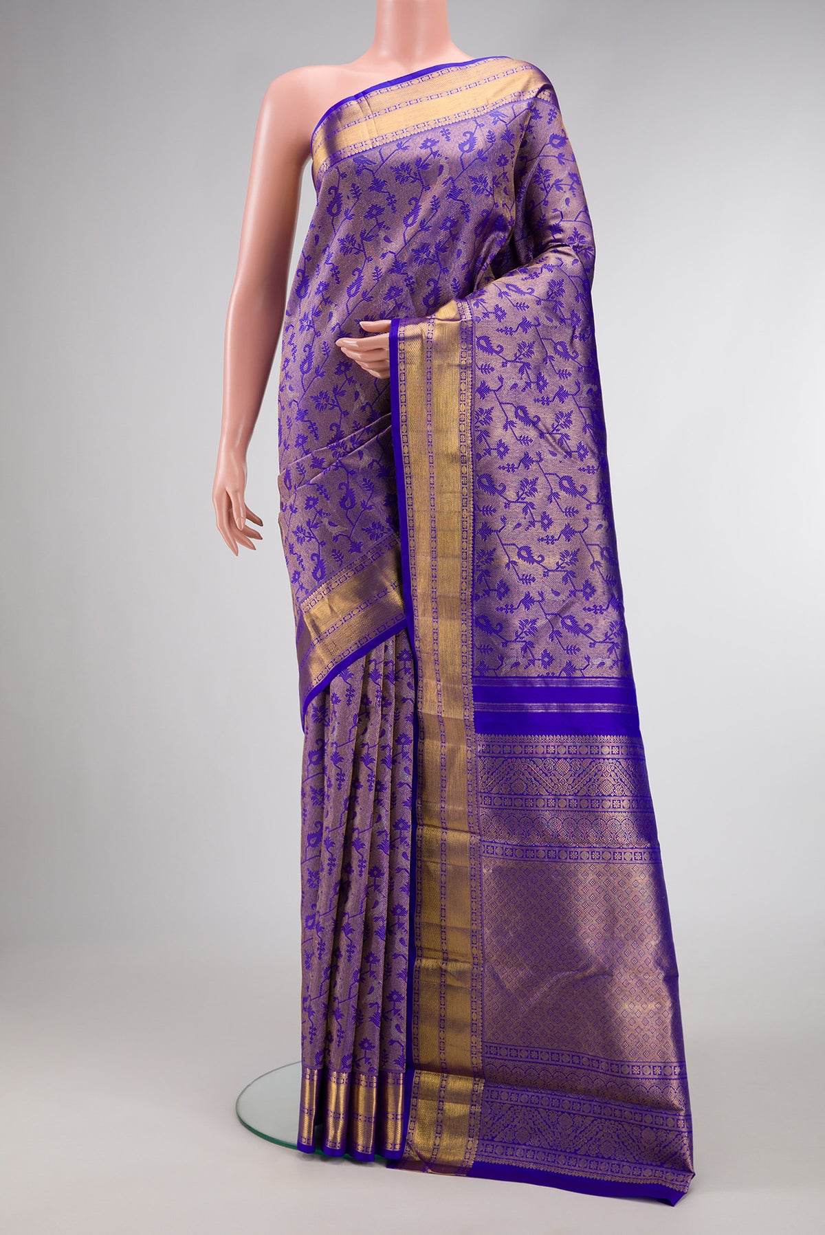 Royal Blue Kanchipuram Silk Saree with Zari Brocade on the body and Zari Border.  displayed on a mannequin