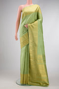 Pista Green Dual Tone Kanjivaram Silk Saree with Zari Butta on the body and Fancy Border.  displayed on a mannequin