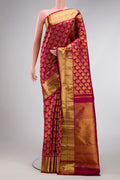 Maroon Dual Tone Kanjivaram Silk Saree with Zari Brocade on the body and Zari Border.  displayed on a mannequin