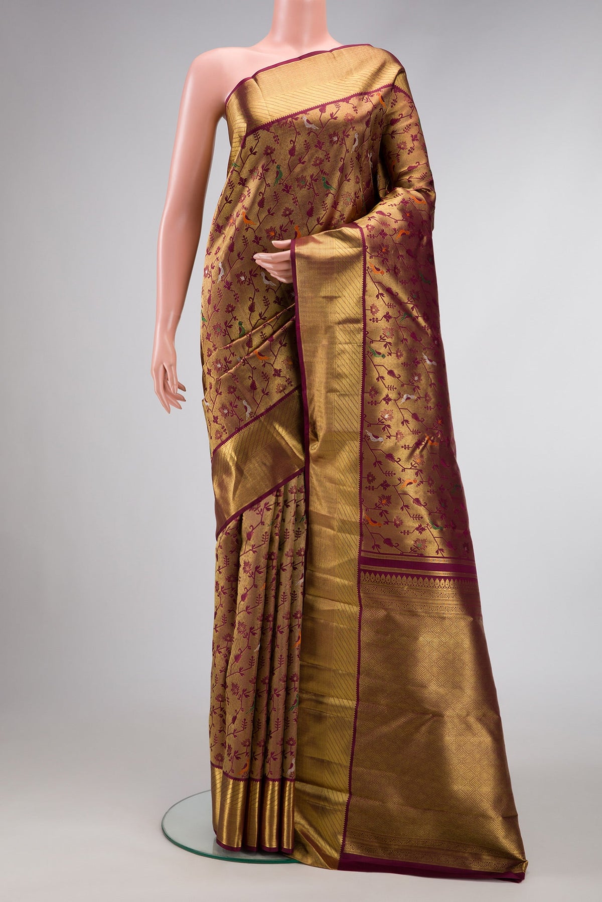 Pure Silk Pure Zari Burgundy Dual Tone Kanjivaram Saree with Zari Brocade on the body and Zari Border.  displayed on a mannequin
