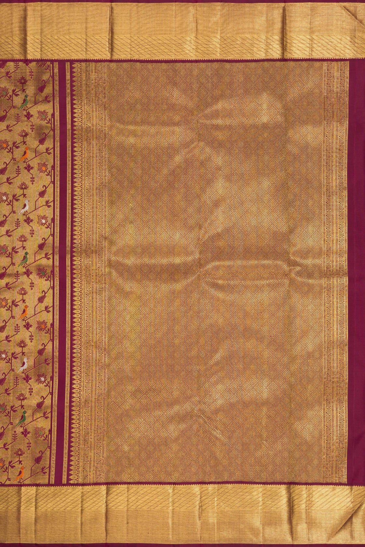 Close up image of the pallu of Pure Silk Pure Zari Burgundy Dual Tone Kanjivaram Saree with Zari Brocade on the body and Zari Border. 