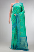 Pure Silk Pure Zari Sea Green Dual Tone Kanjivaram Saree with Zari Butta on the body and Zari Border.  displayed on a mannequin